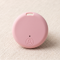 CozyPaws Mini Bluetooth Pet Tracker Tag in pink with location button and collar attachment hole - Image 1