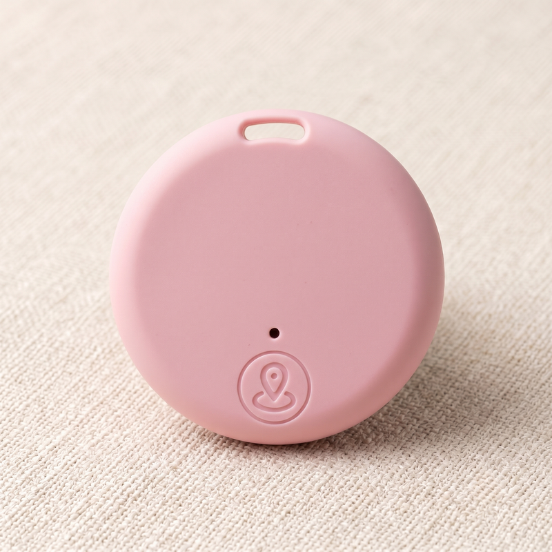 CozyPaws Mini Bluetooth Pet Tracker Tag in pink with location button and collar attachment hole