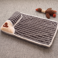 CozyPaws memory foam dog bed in dark gray colour with cream sherpa trim and heart-shaped pillow, flat lay view with plush duck toy - Image 7