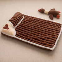 CozyPaws memory foam dog bed in coffee brown colour with cream sherpa trim and heart-shaped pillow, flat lay view with plush duck toy - Image 8