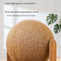 Close-up of the tightly wound natural sisal rope ball on the CozyPaws cat scratching ball showing durable spiral winding detail and wooden frame - Image 4